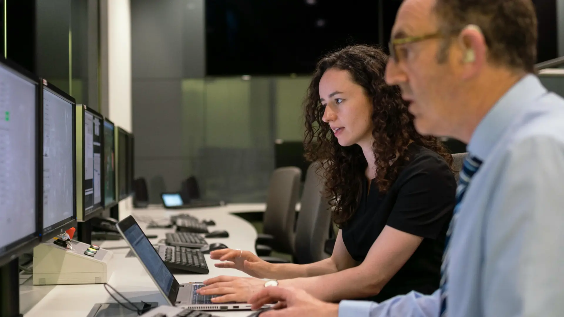 Consultants performing usability testing on desktop computers